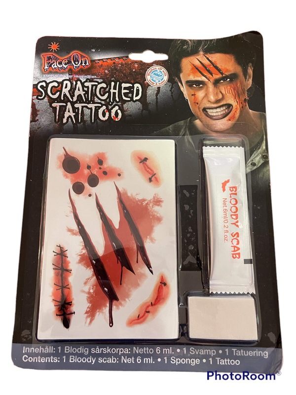 Face on Scratched Tattoo
