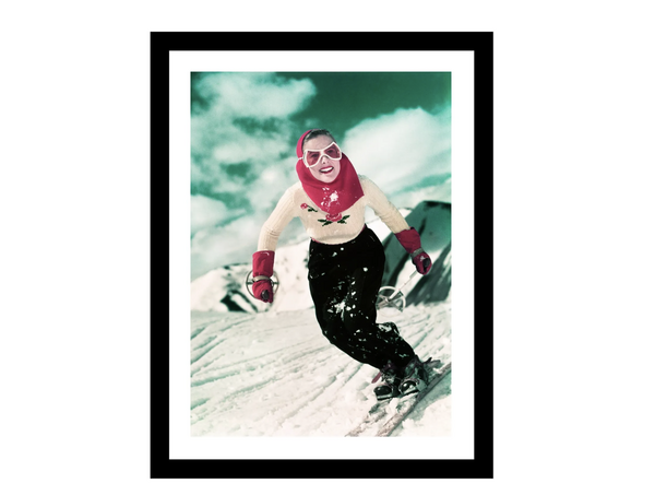 Bilde med glass og ramme."Glad dame på ski"